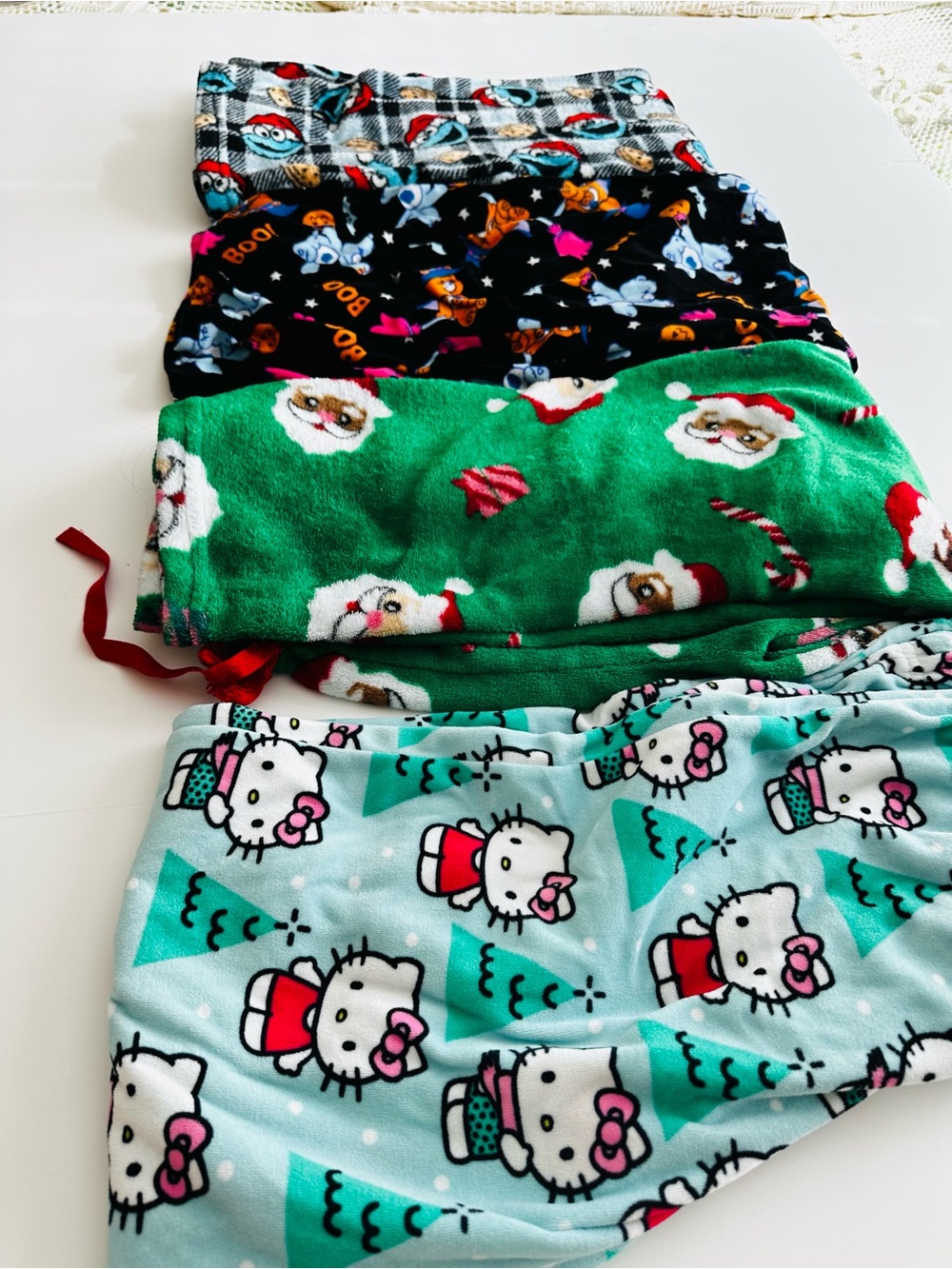 Set of 4 Fleece teen loungewear bottoms seasonal and Character Print. Size Small